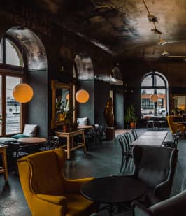 a table with two glasses and candles